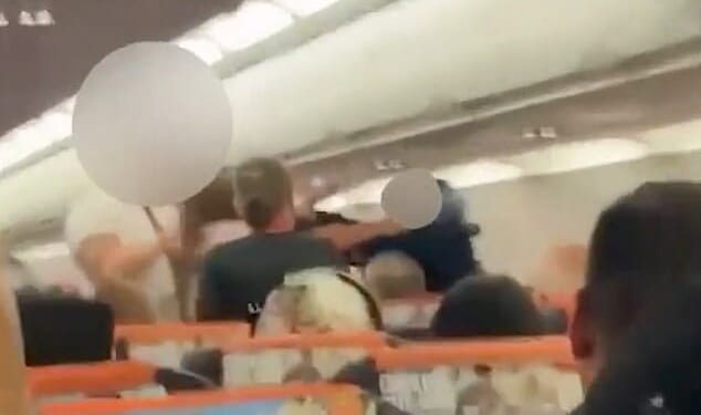 Footage shows a drunken brawl on board a flight from London's Gatwick Airport to Antalya, Turkey