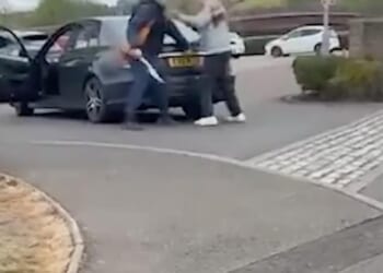 Footage shows the moment the violent knifeman hacks at a 77-year-old man who is understood to have been stabbed inside the black Mercedes car