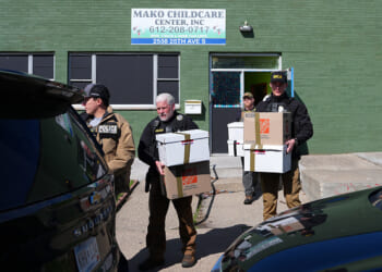 Federal agents remove documents from a childcare center in South Minneapolis.