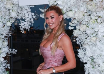 Christine McGuinness ensured all eyes were on her as the last guest to arrive at a lavish dinner to celebrate the relaunch of tanning brand Skin and Tan yesterday