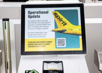 The Spirit Airlines ticket counter at Detroit Metro Airport is closed down after the airline shut down Saturday in Romulus, Michigan.