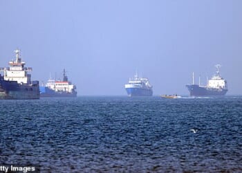 TOPSHOT - In this picture obtained from Iran's ISNA news agency on May 4, 2026, vessels are pictured anchored in the Strait of Hormuz off Bandar Abbas in southern Iran. Iran's Revolutionary Guards on May 4 denied that any commercial ships had crossed the Strait of Hormuz, after the US military earlier said two US-flagged merchant vessels had transited through the vital waterway. (Photo by Amirhossein KHORGOOEI / ISNA / AFP via Getty Images) /  *** BESTPIX ***