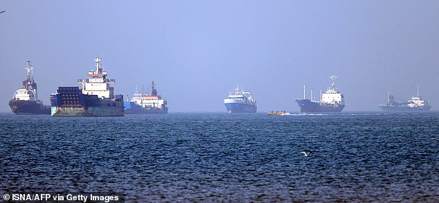 TOPSHOT - In this picture obtained from Iran's ISNA news agency on May 4, 2026, vessels are pictured anchored in the Strait of Hormuz off Bandar Abbas in southern Iran. Iran's Revolutionary Guards on May 4 denied that any commercial ships had crossed the Strait of Hormuz, after the US military earlier said two US-flagged merchant vessels had transited through the vital waterway. (Photo by Amirhossein KHORGOOEI / ISNA / AFP via Getty Images) /  *** BESTPIX ***