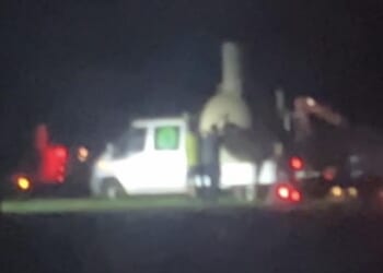 Using floodlights and generators several men worked through the night to concrete over the countryside