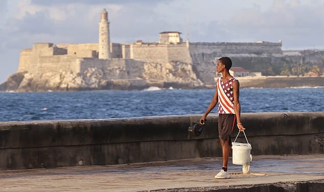 President Trump suggested plans to take over Cuba 'almost immediately,' after 'finishing the job' in Iran. Pictured: A person walks along an area of the Malecon in Havana, Cuba, on April 9
