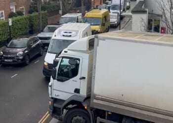 A lorry attempting to reverse down the ramp on Elystan Place, while traffic backs up