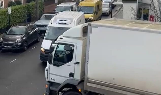 A lorry attempting to reverse down the ramp on Elystan Place, while traffic backs up