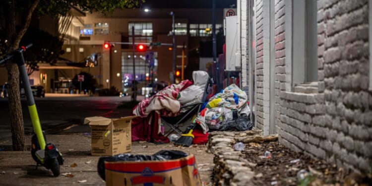 A southern street is strewn with trash.
