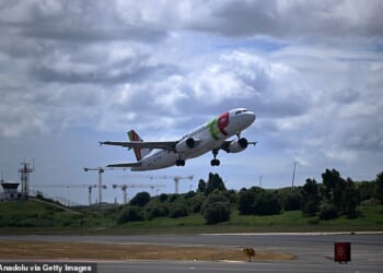 A plane takes off from Lisbon Airport in Portugal yesterday as jet fuel prices continue to rise