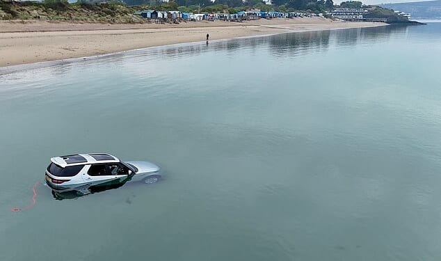 A photo taken of the hilarious incident showed almost all of the silver Land Rover Discovery submerged beneath the calm waters